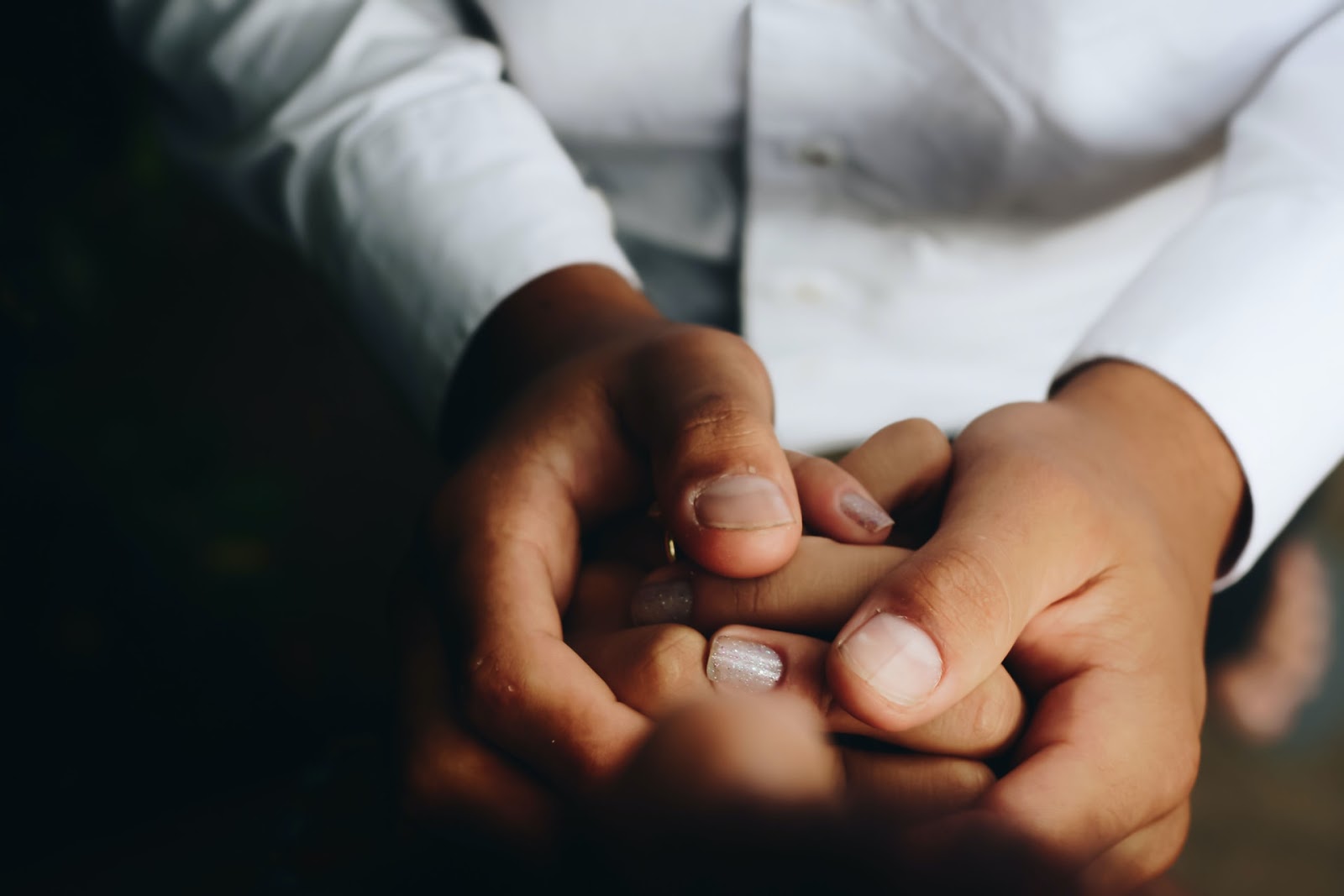 A guy holding a woman hand