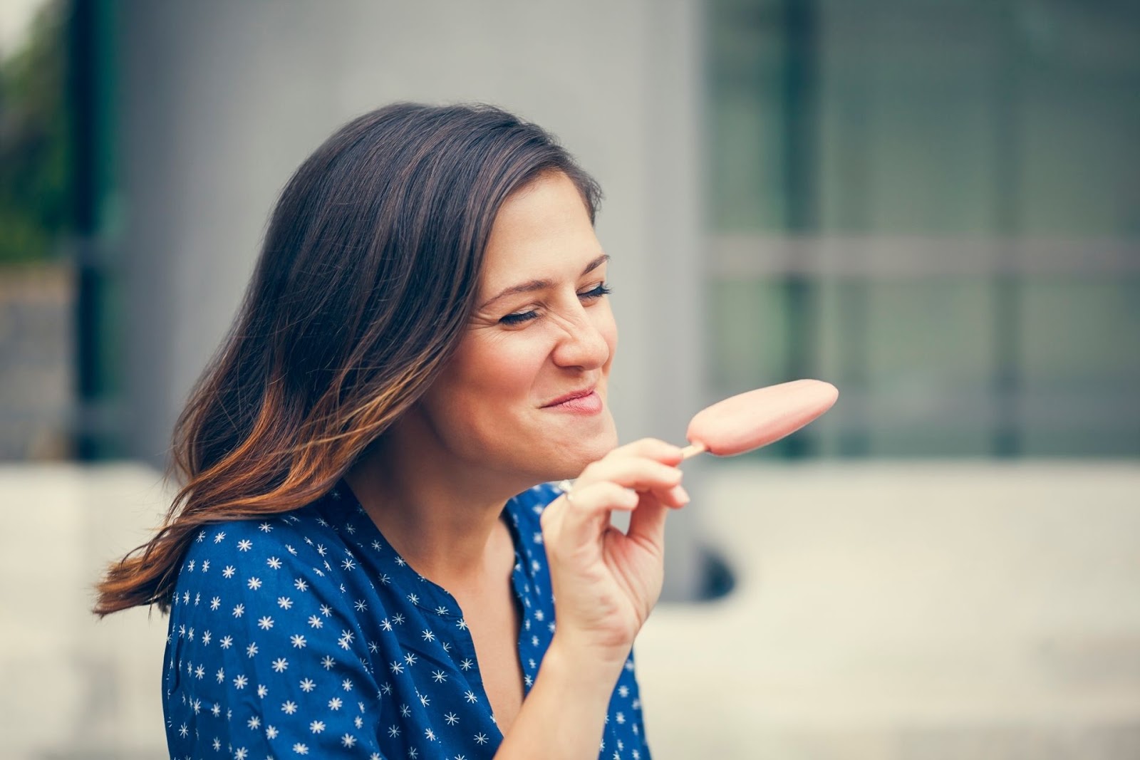 woman eating ice cream bar
