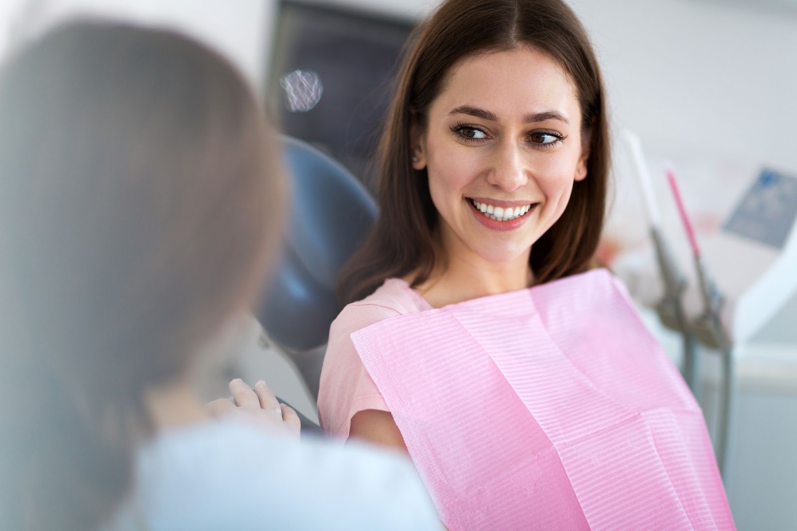 dentist talking to patient