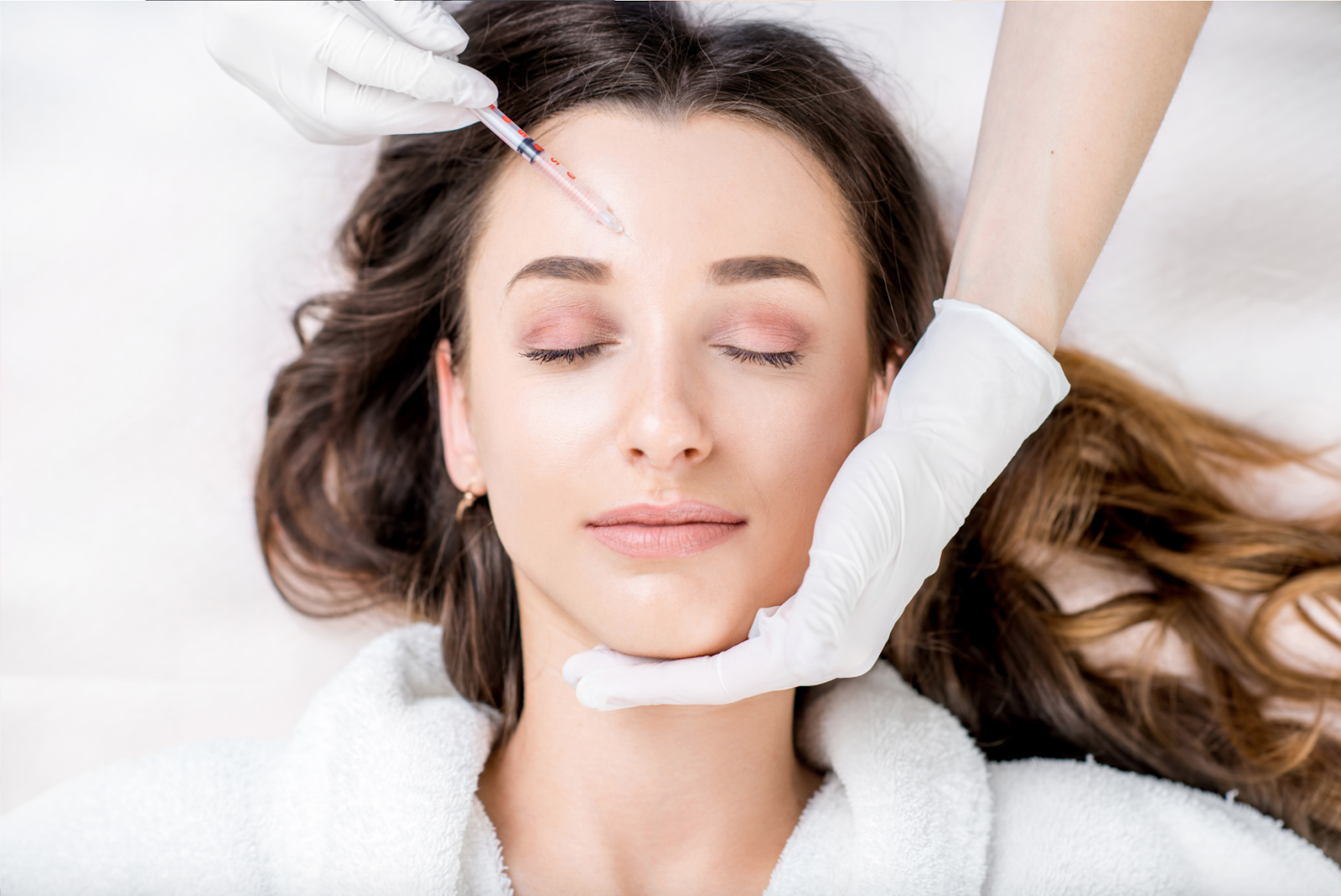 Woman getting botox treatment in forehead