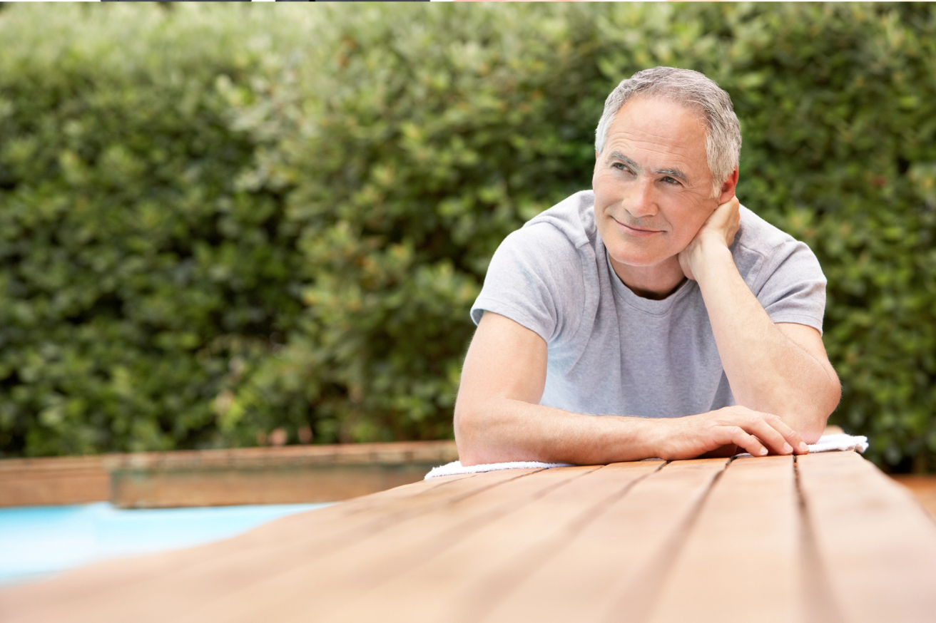 Older man sitting outside