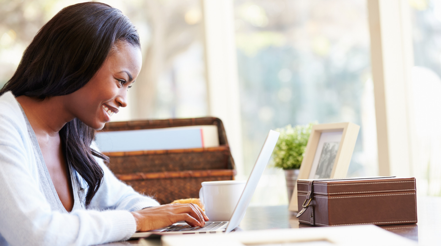woman typing on laptop