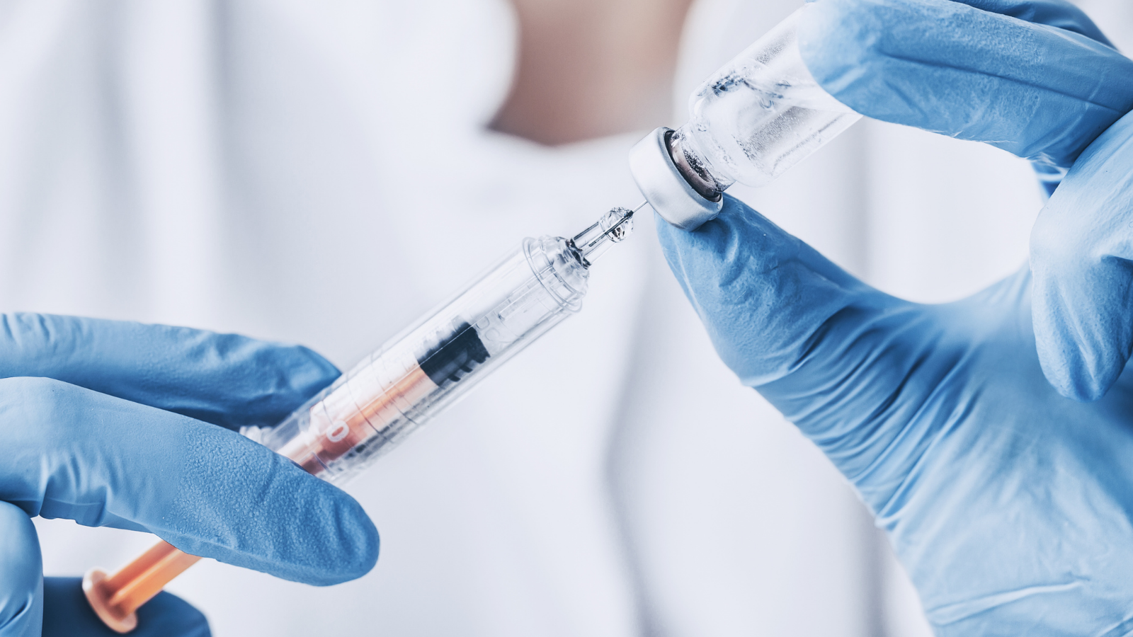closeup of Botox being pulled into syringe