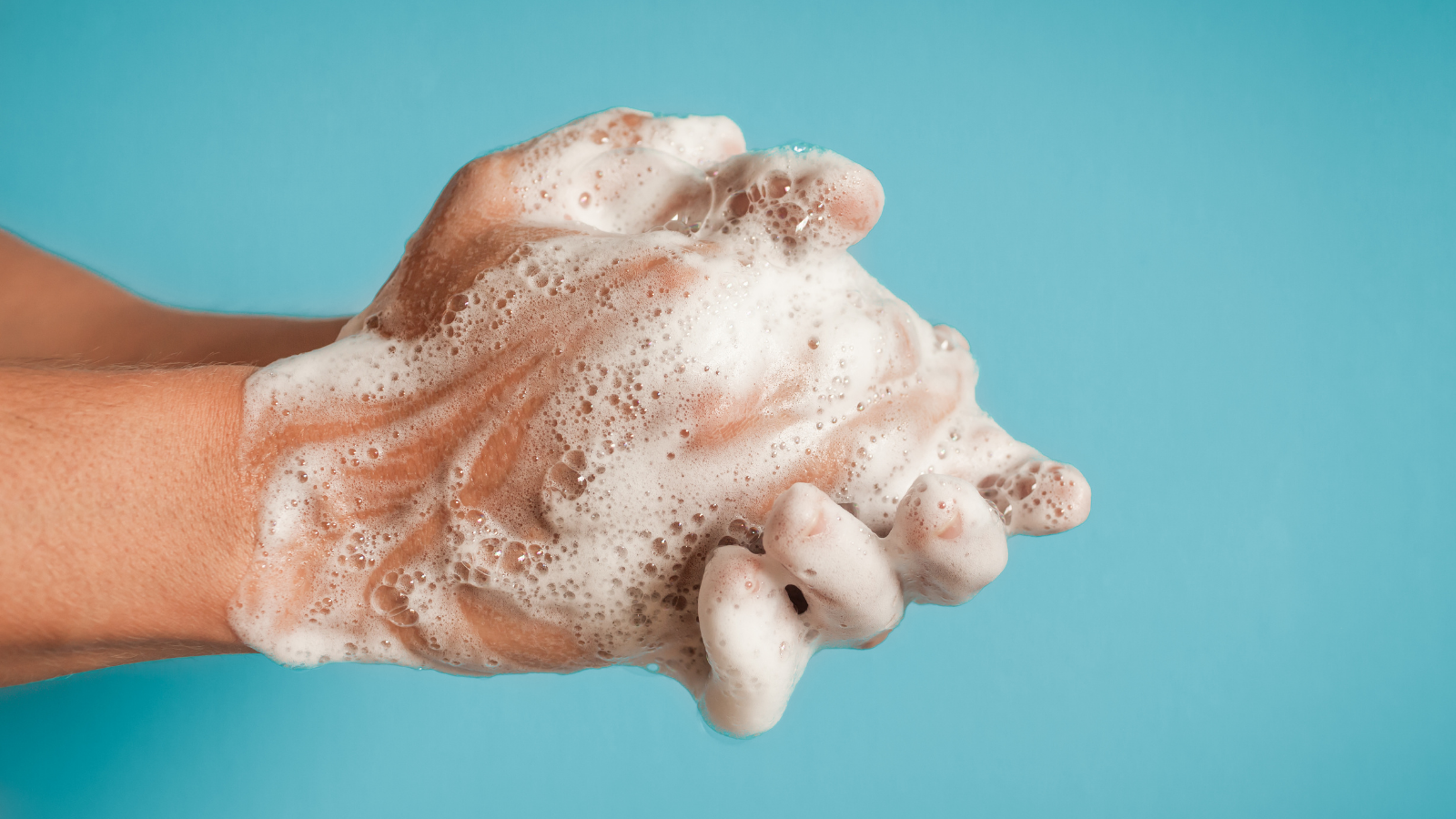 closeup of person washing their hands