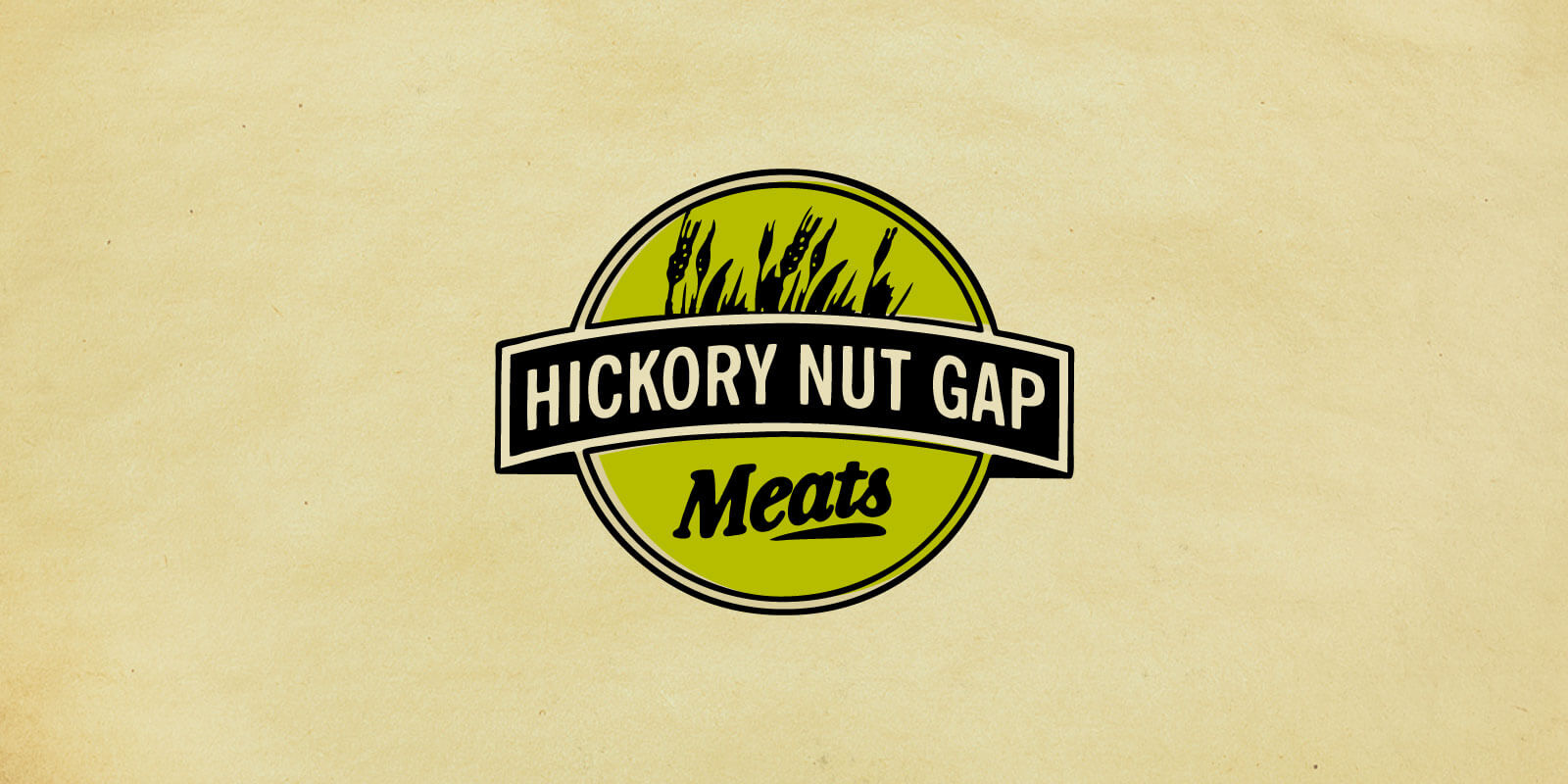 Hickory Nut Gap Meats logos in green and black shown against parchment paper background.