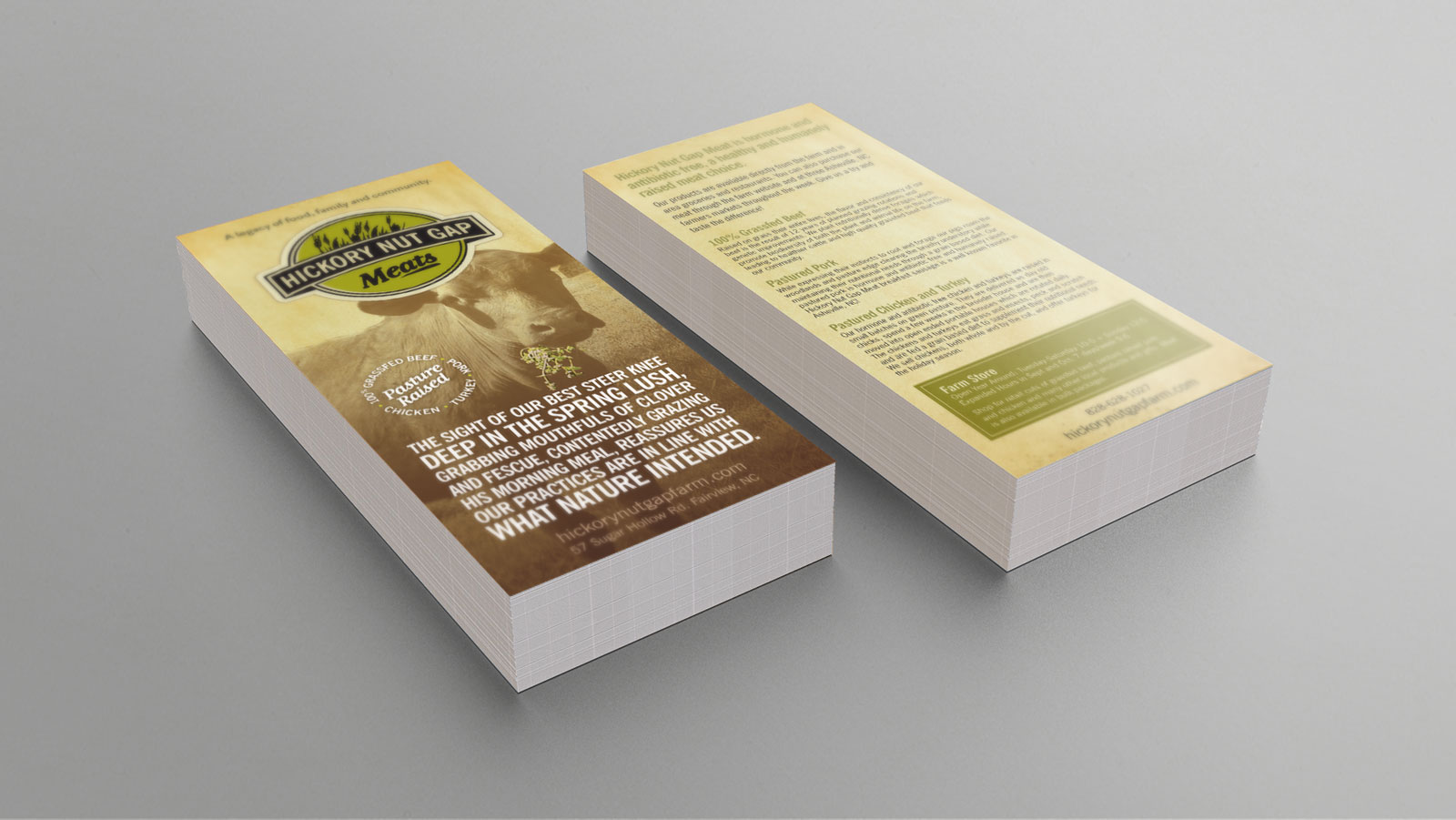 Hickory Nut Gap Meats rack card with cow eating grass and logo centered