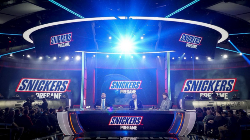 Snickers has been advertising in esports for years. This image shows a studio in which announcers are covering ELeague's pregame. Featured six times is "Snickers Pregame."