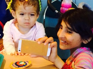 Afghan war victim Shah Bibi Tarakhai, who lost her arm after picking up a grenade and sought the help of Childrens War Foundation, bonds with Ana Paula at Childrens Shriners Hospital in Los Angeles.