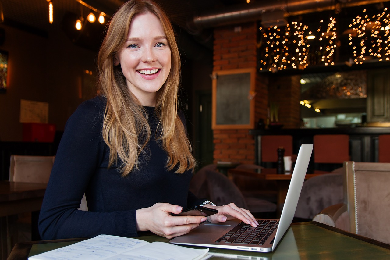 woman smiling on computer