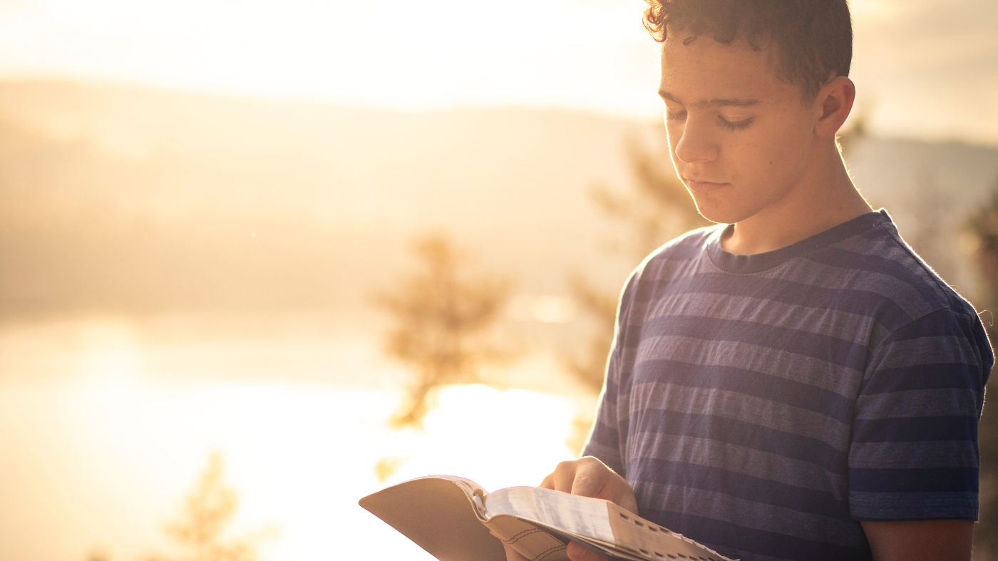 Kid reading bible