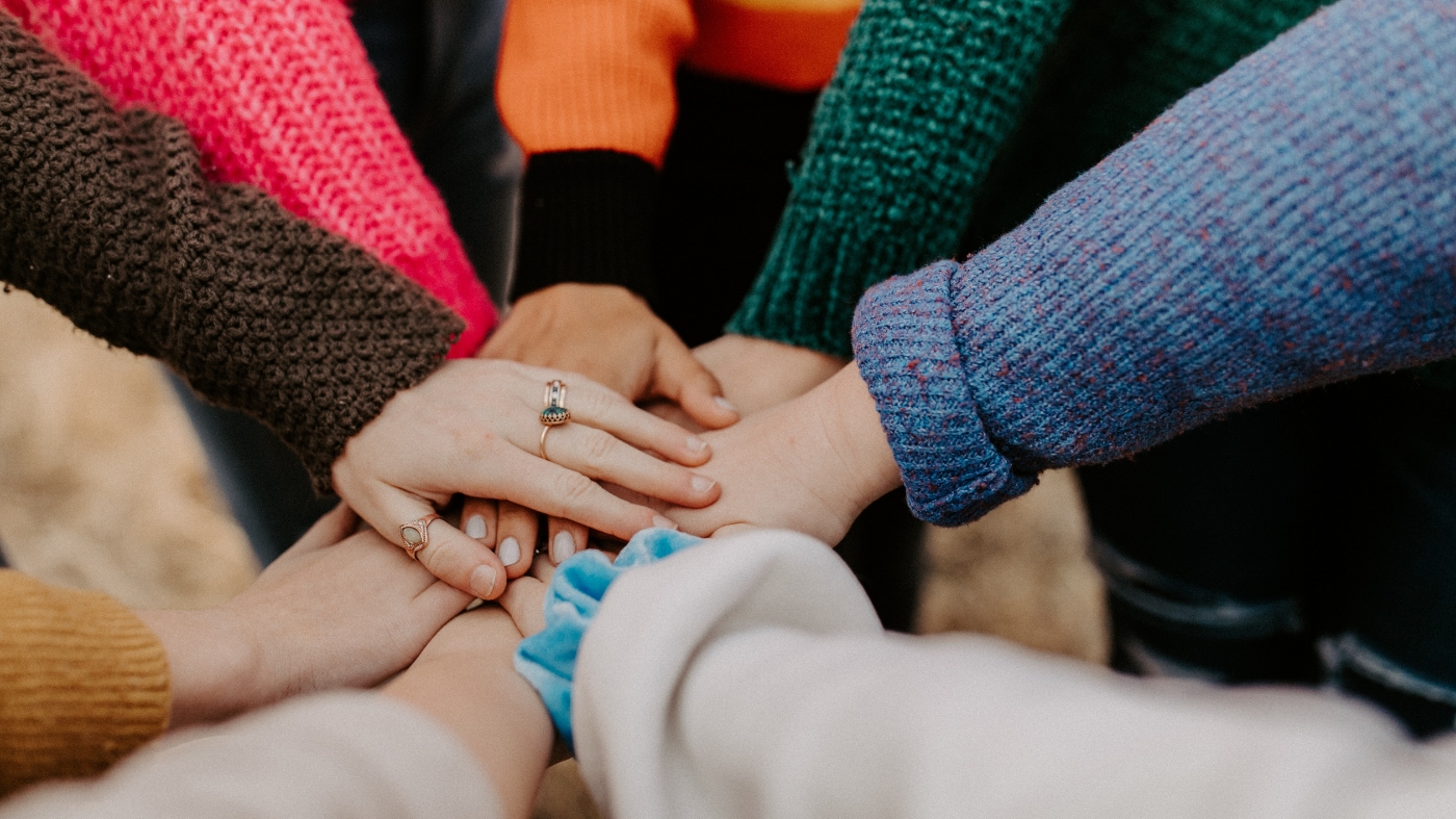 Team joining hands