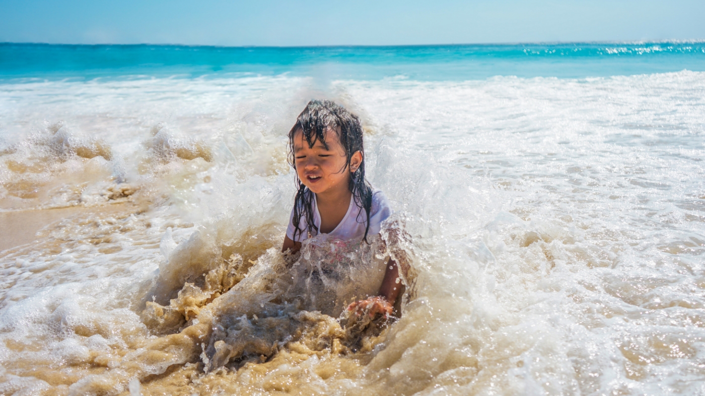 Kid playing on the beach