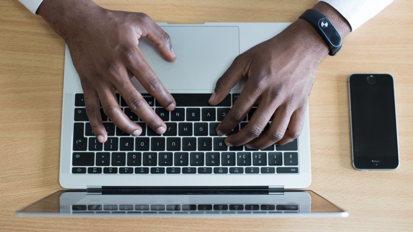 Checking email on laptop