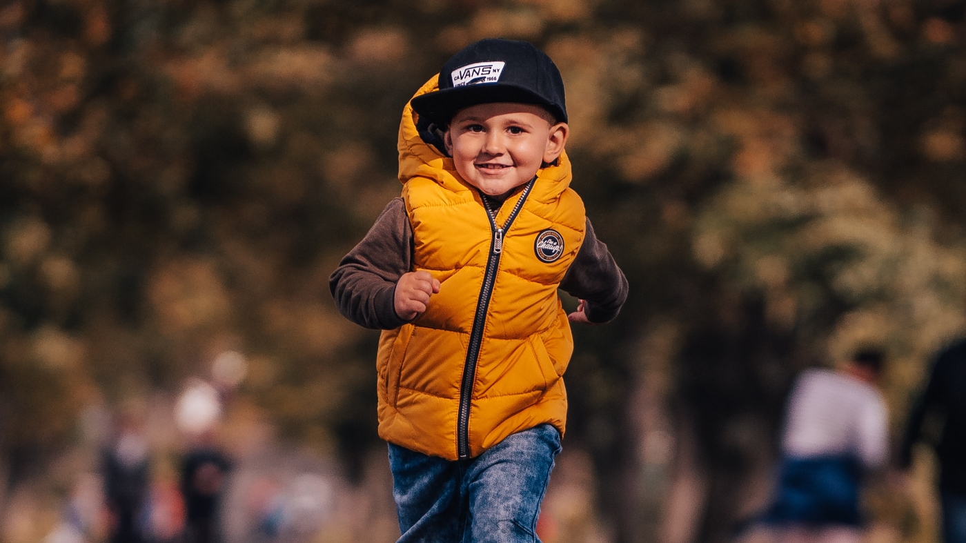 Kid smiling and running