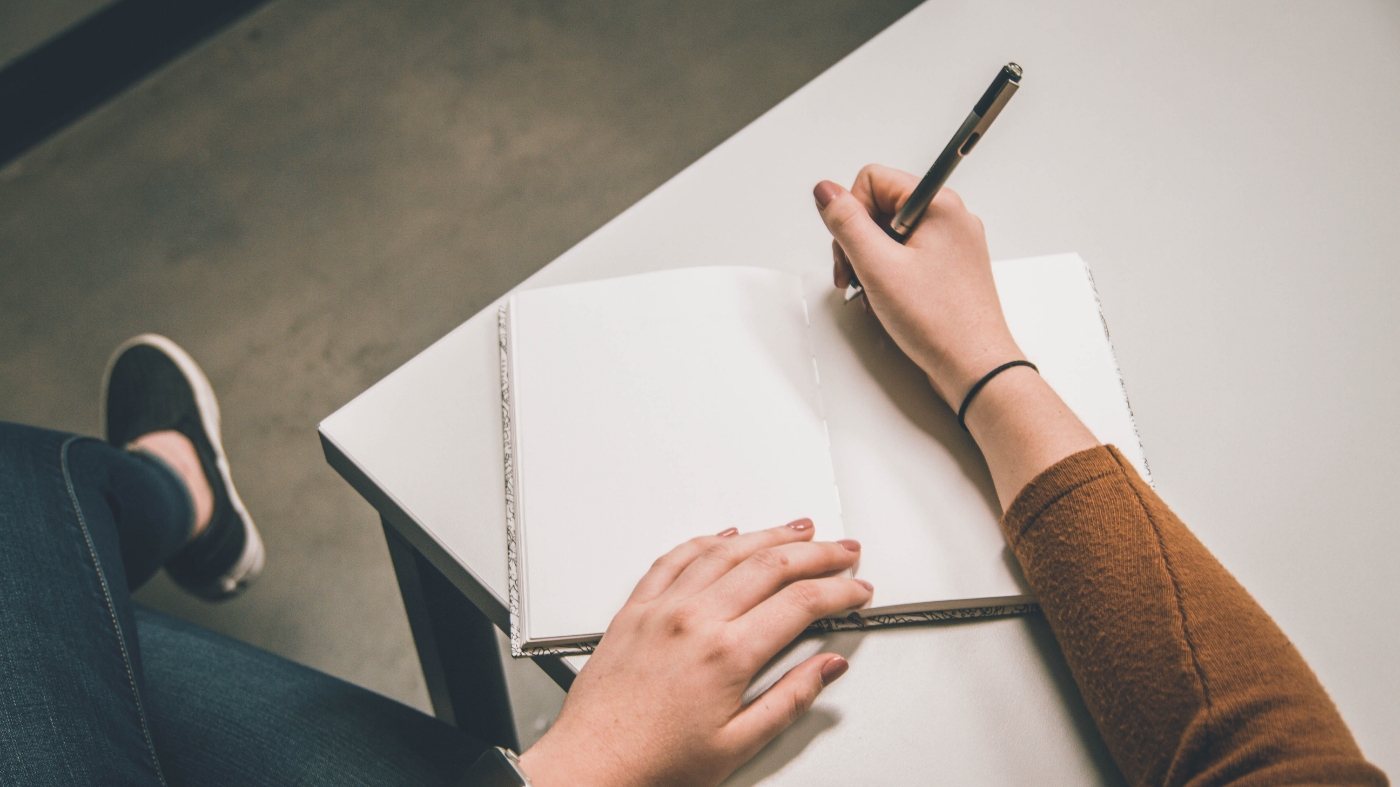 Lady writing down notes