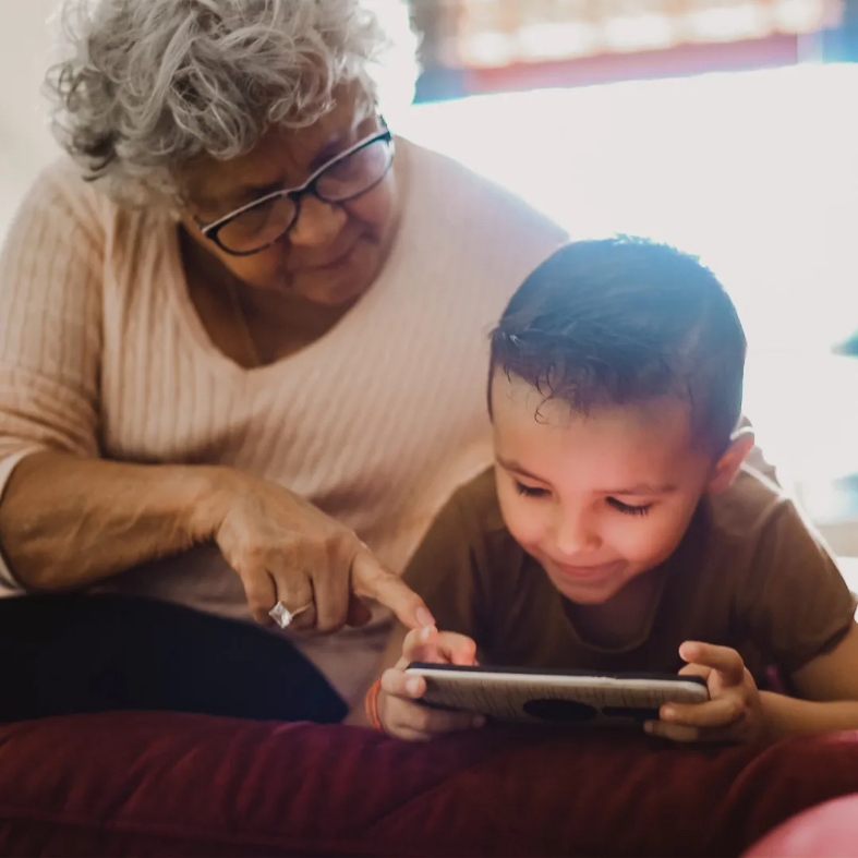 Grandma playing with her grandson on the Parent Cue app