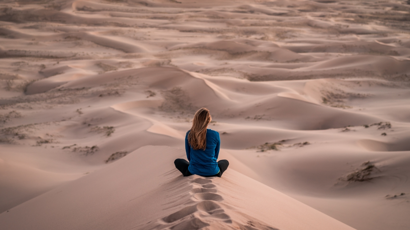 Women in the dessert thinking about life