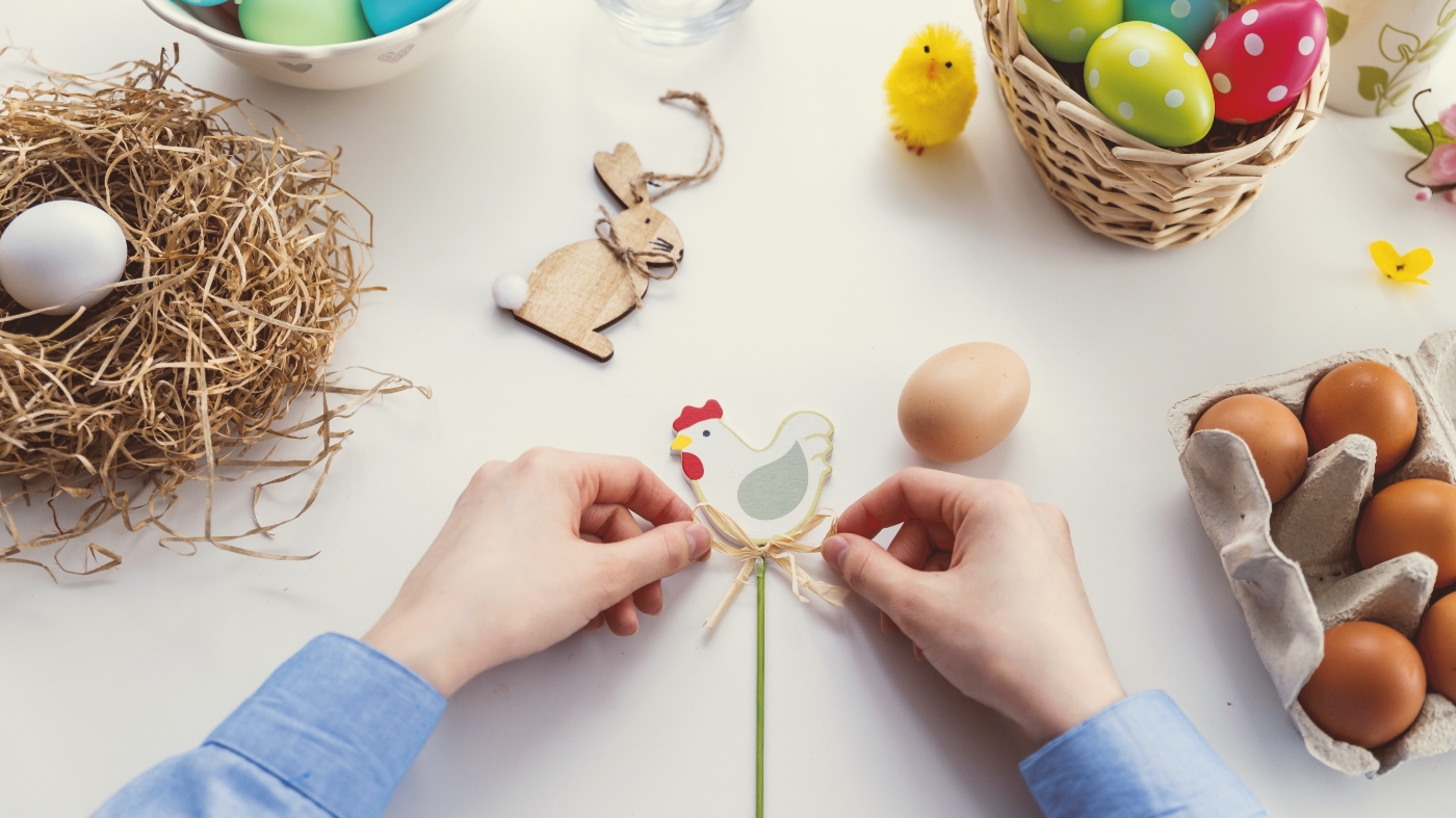 Kid tying a knot on an easter craft