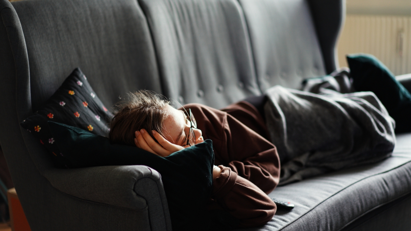 Woman laying on couch with nothing to do