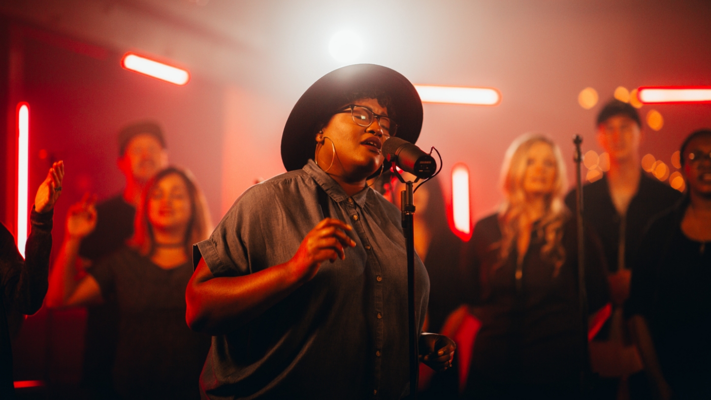 Amazing colored woman singing in church