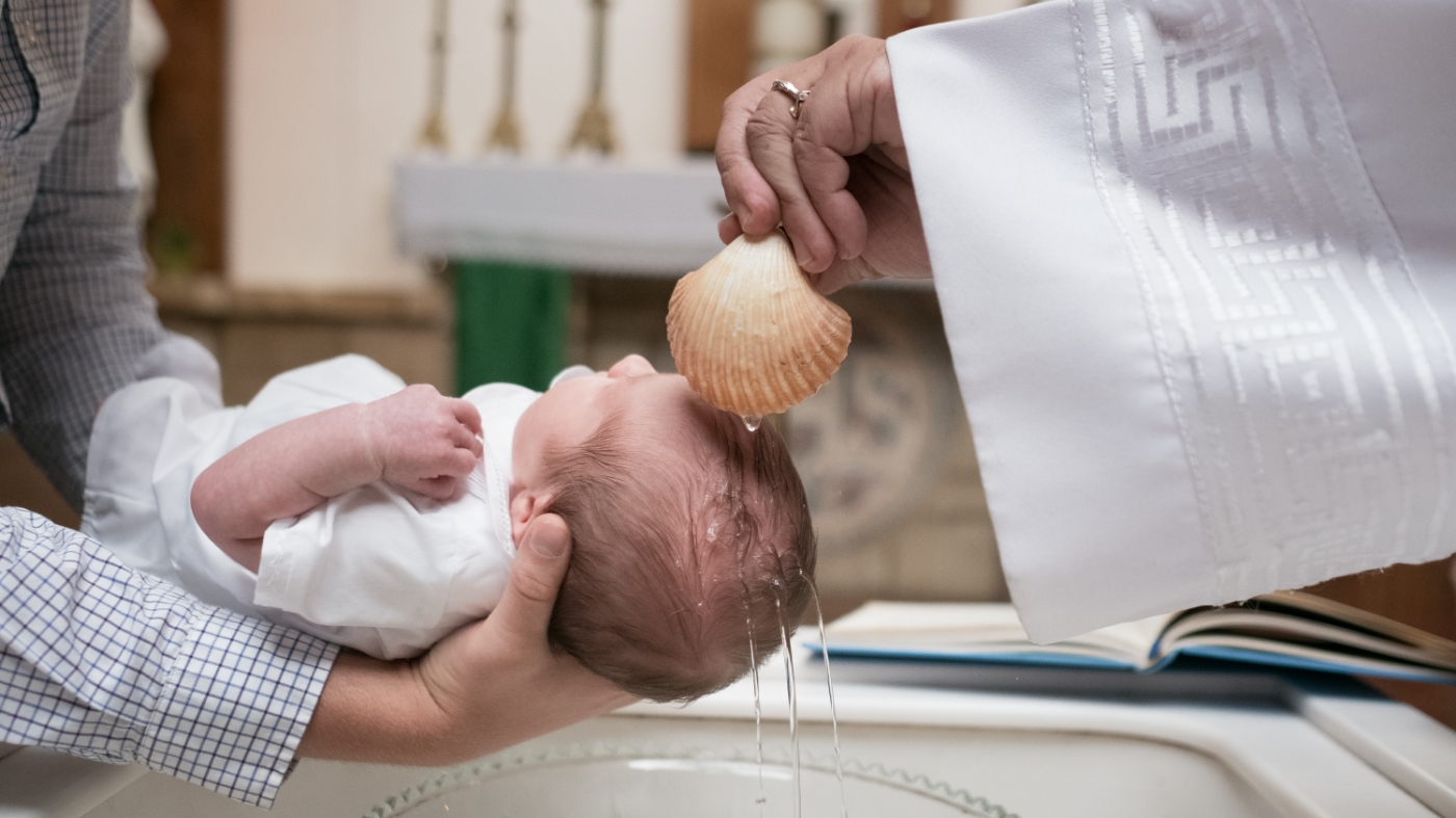 Baby getting baptized
