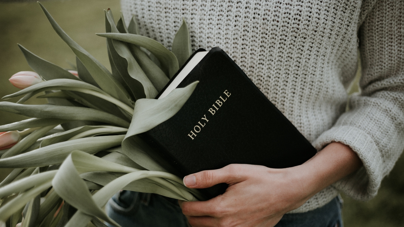 Holding bible
