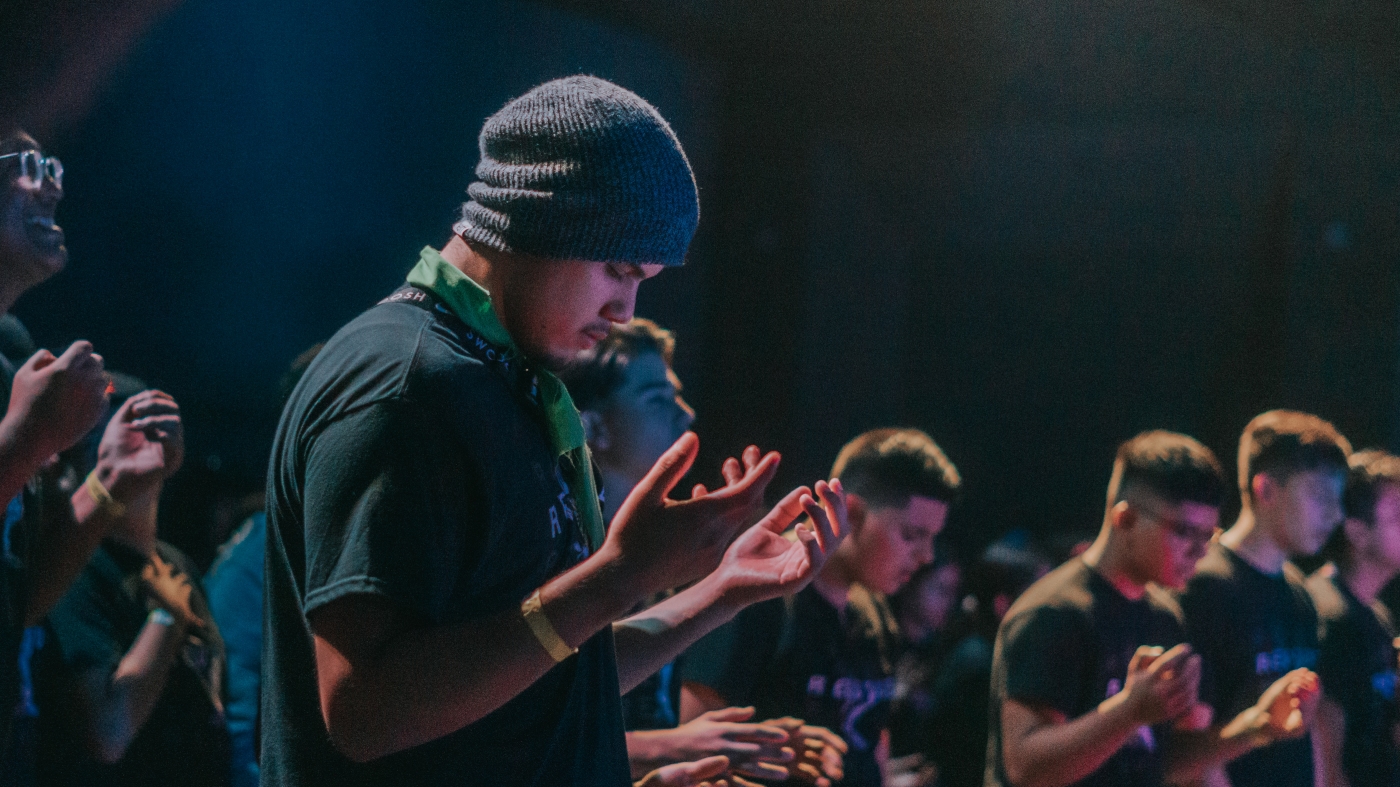 Young adult in worship ready for a mentor