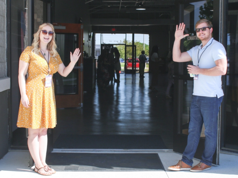 Church volunteers welcoming visitors
