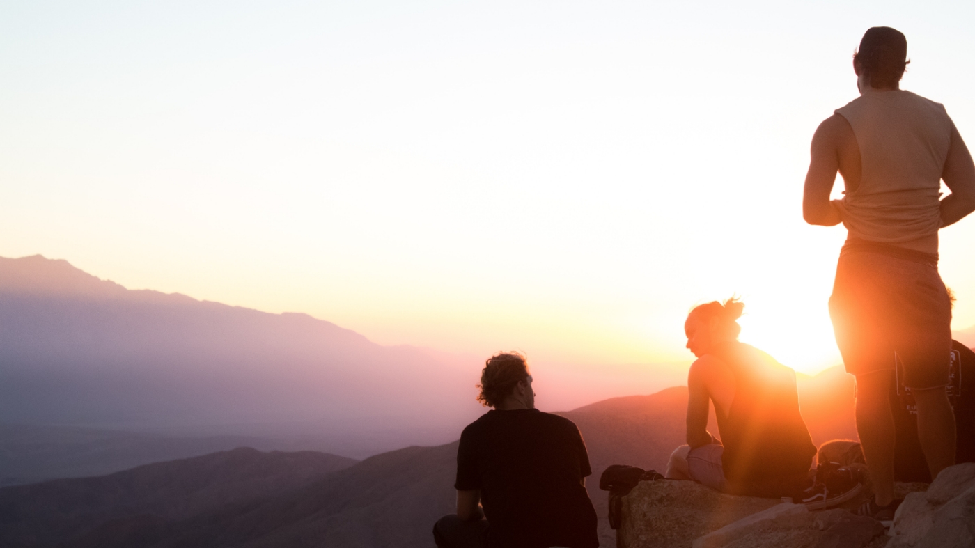 Discipleship on a mountain top sunset