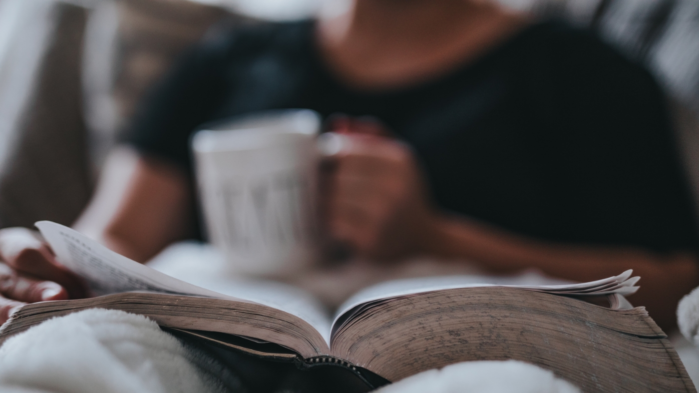 Reading bible and sipping coffee in bed