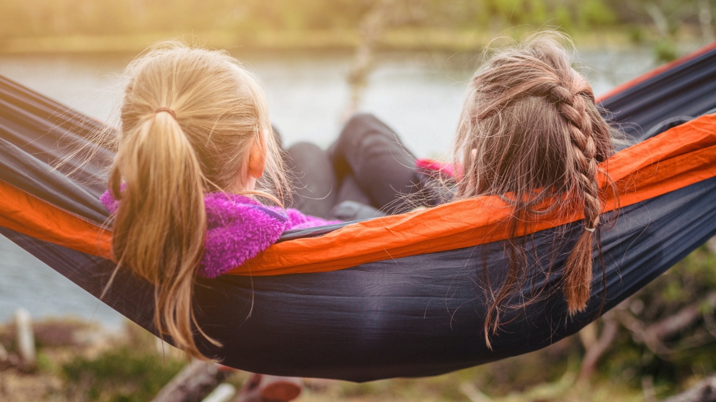 Girls relaxing and resting on a hammock