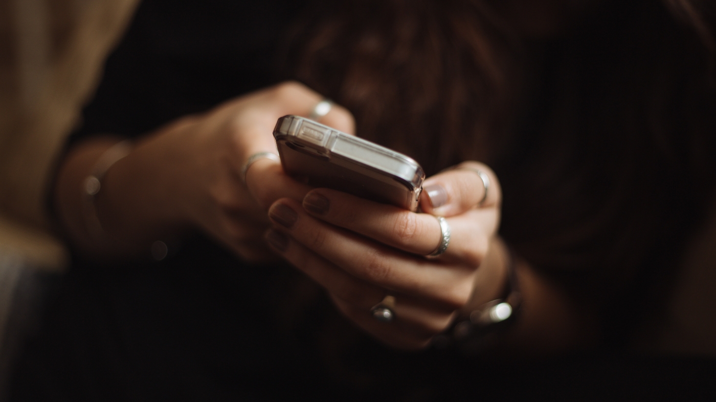 Looking down at phone