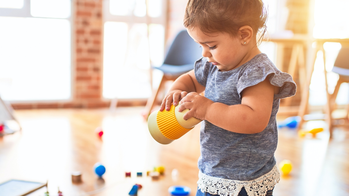 Young girl playing by herself