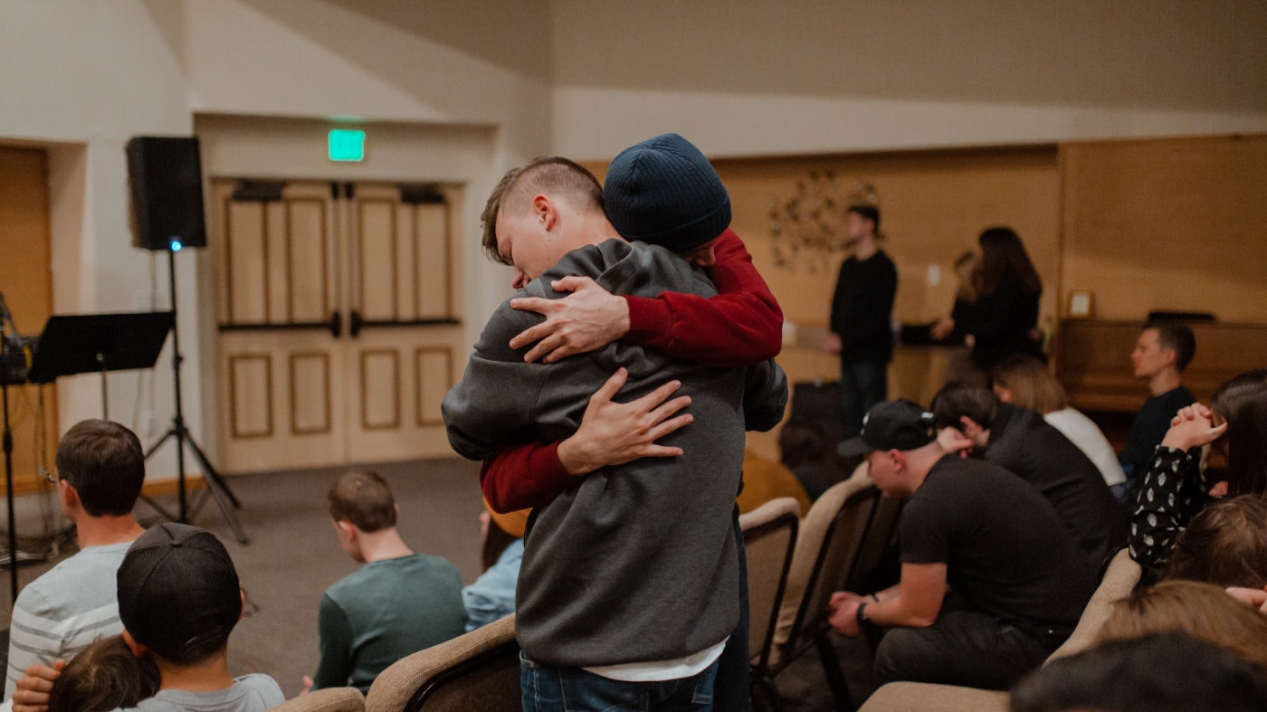 Showing gratitude at church by hugging church members