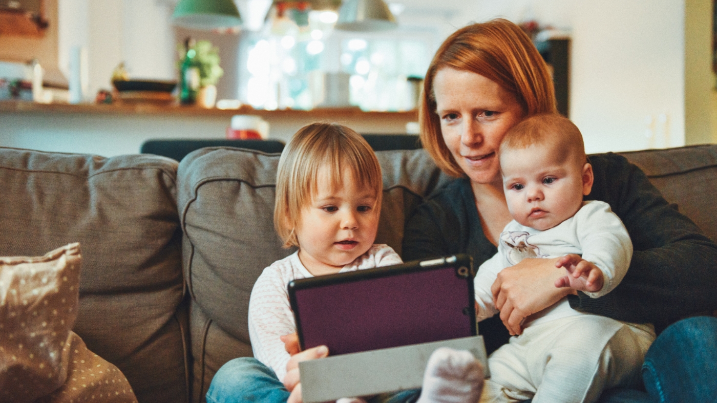 Mom using childrens curriculum to teach her two kids