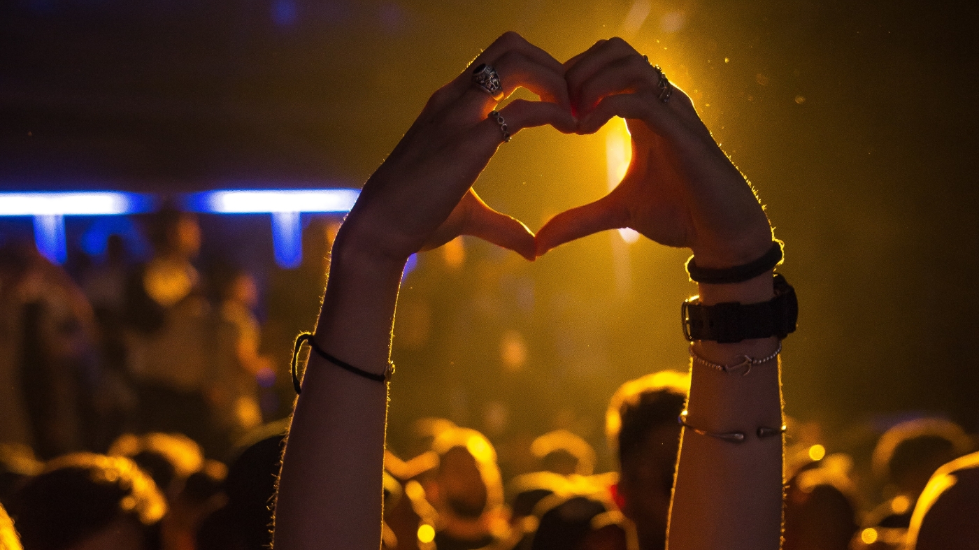 Positive girl making a heart with her hands