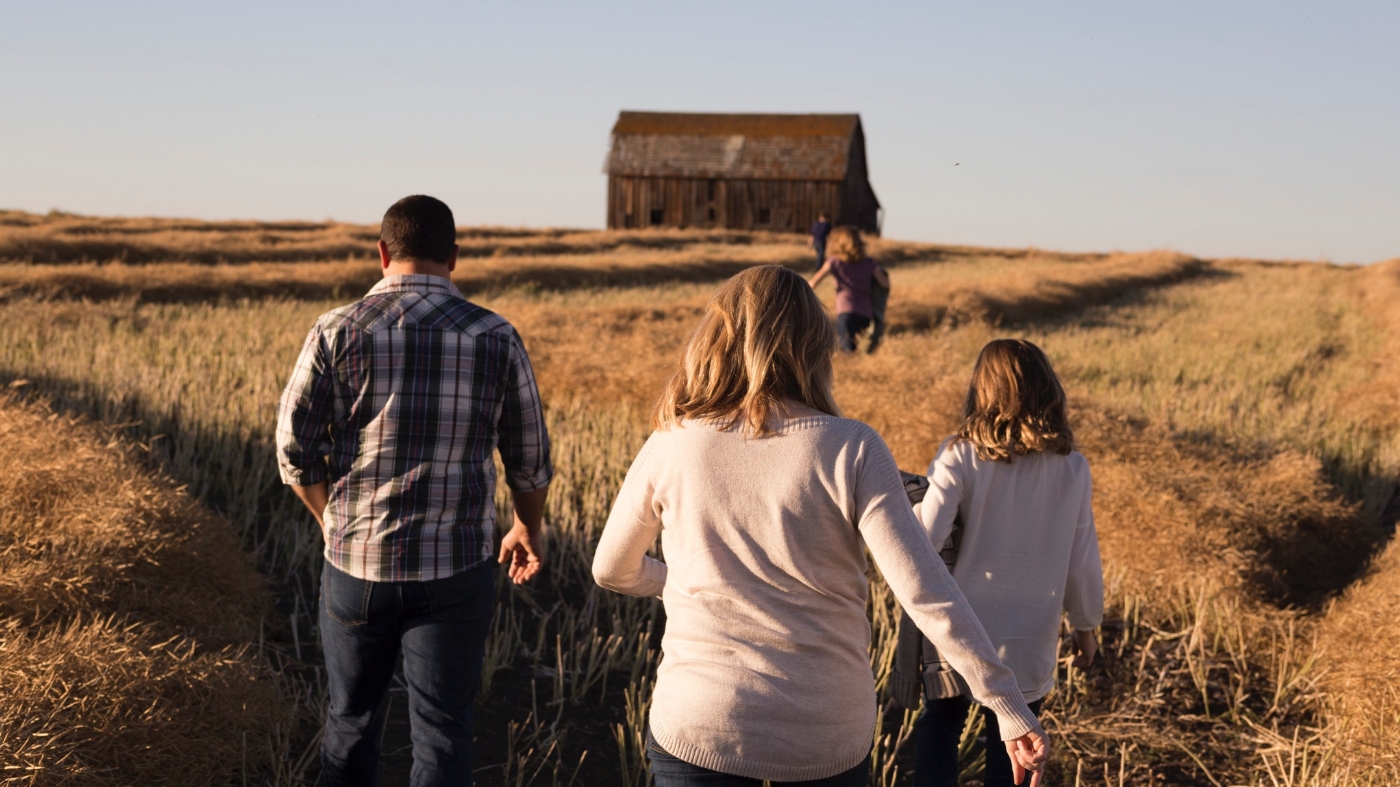 Family walking into the fall festival