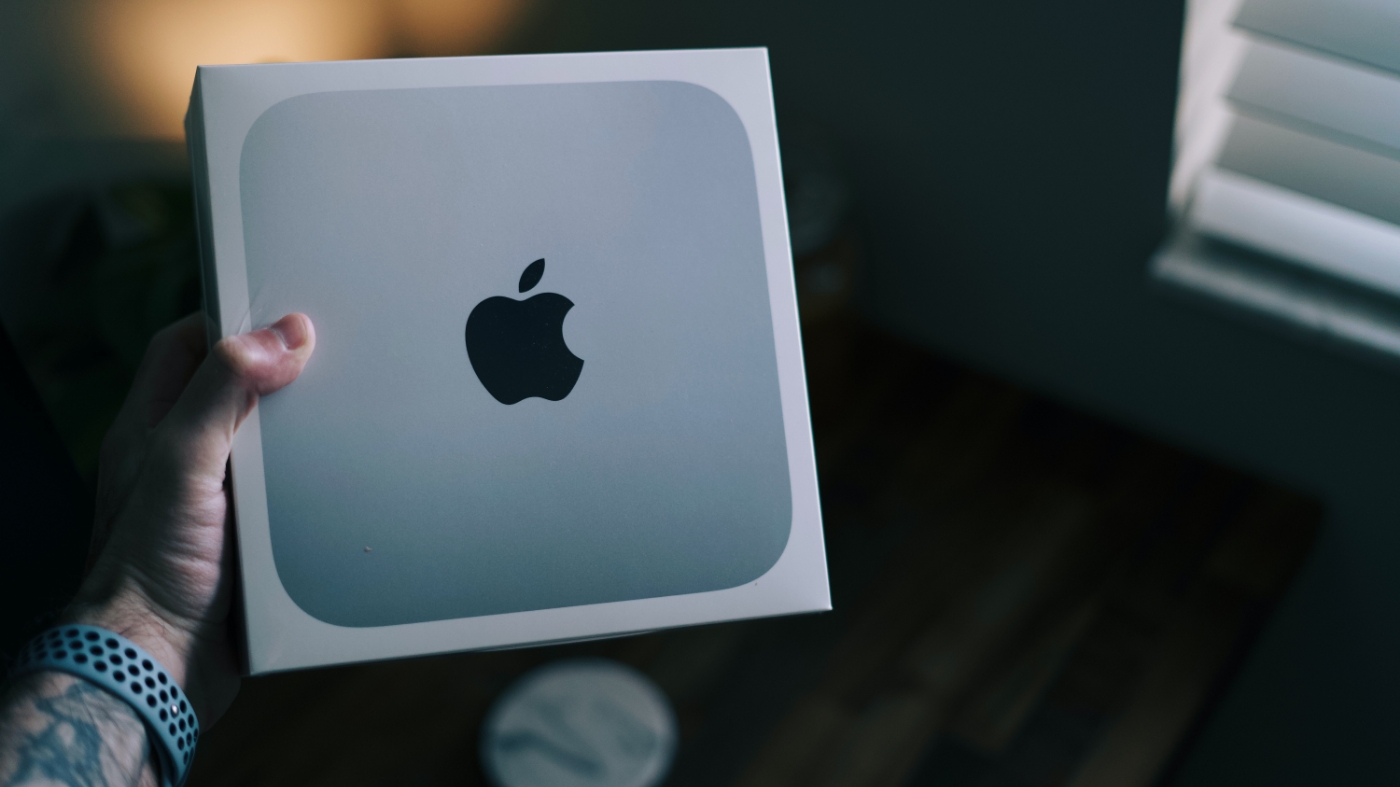 Man holding mac mini