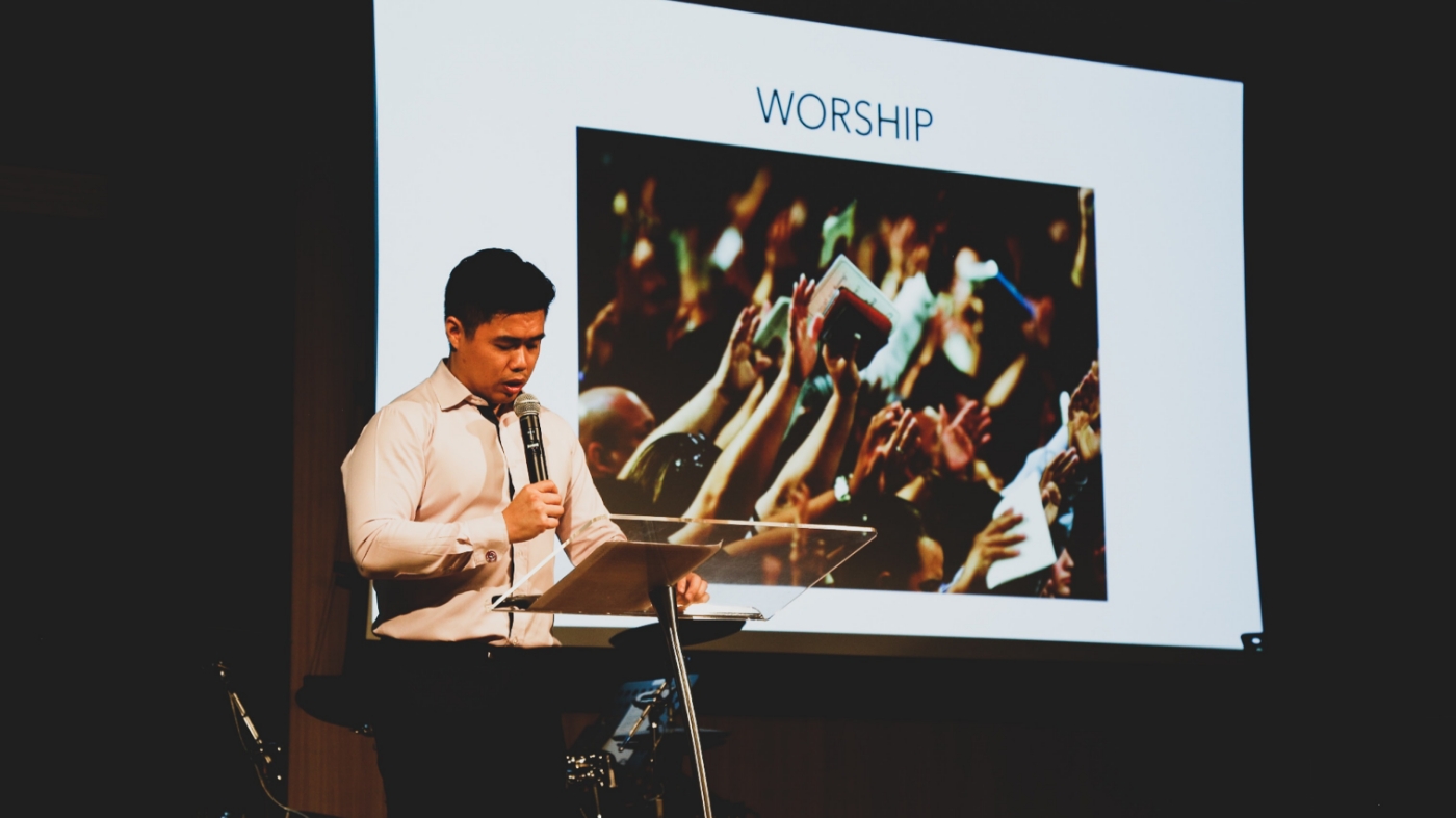 Minister using digital signage while preaching