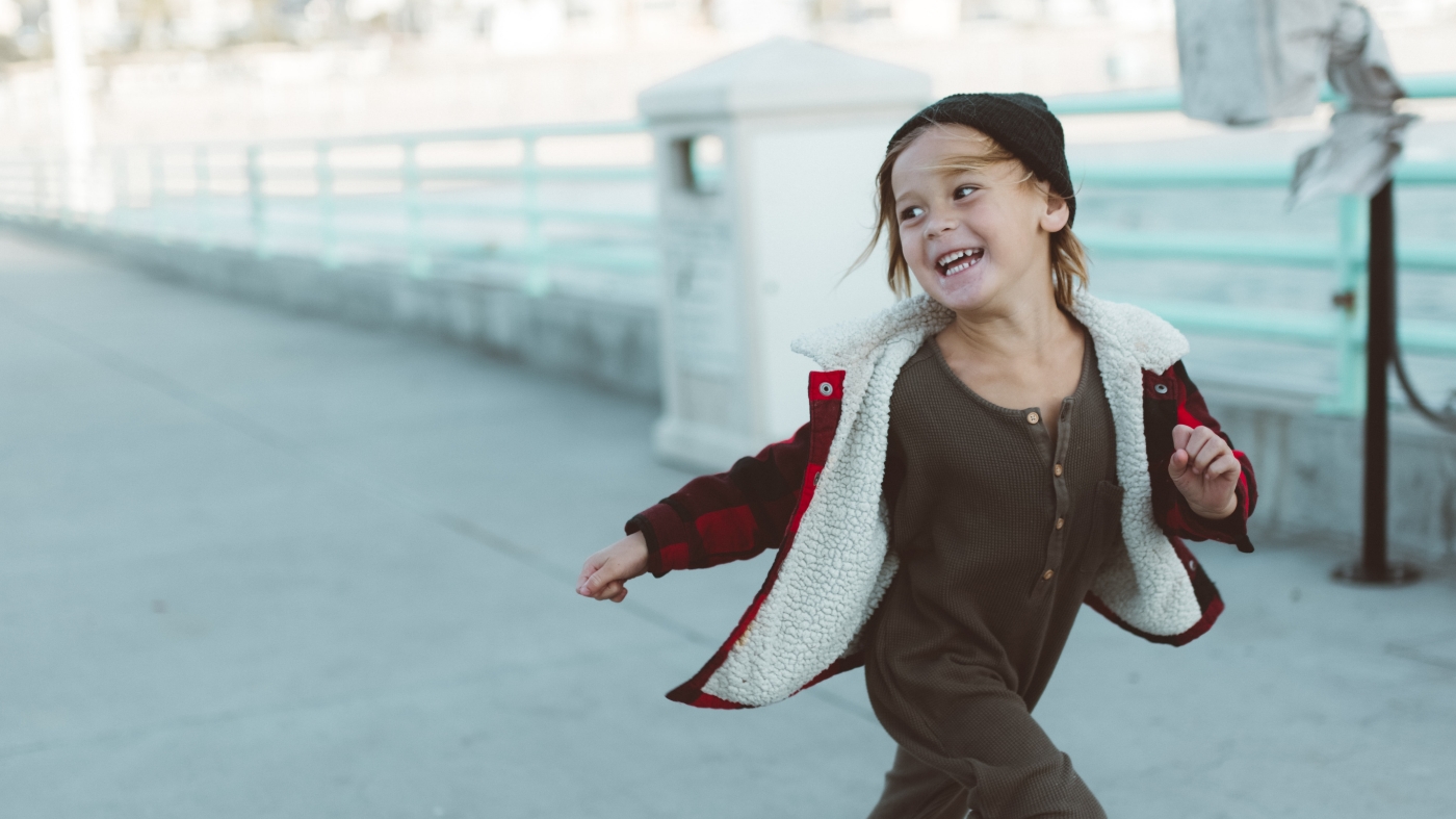 Young kid running around outside