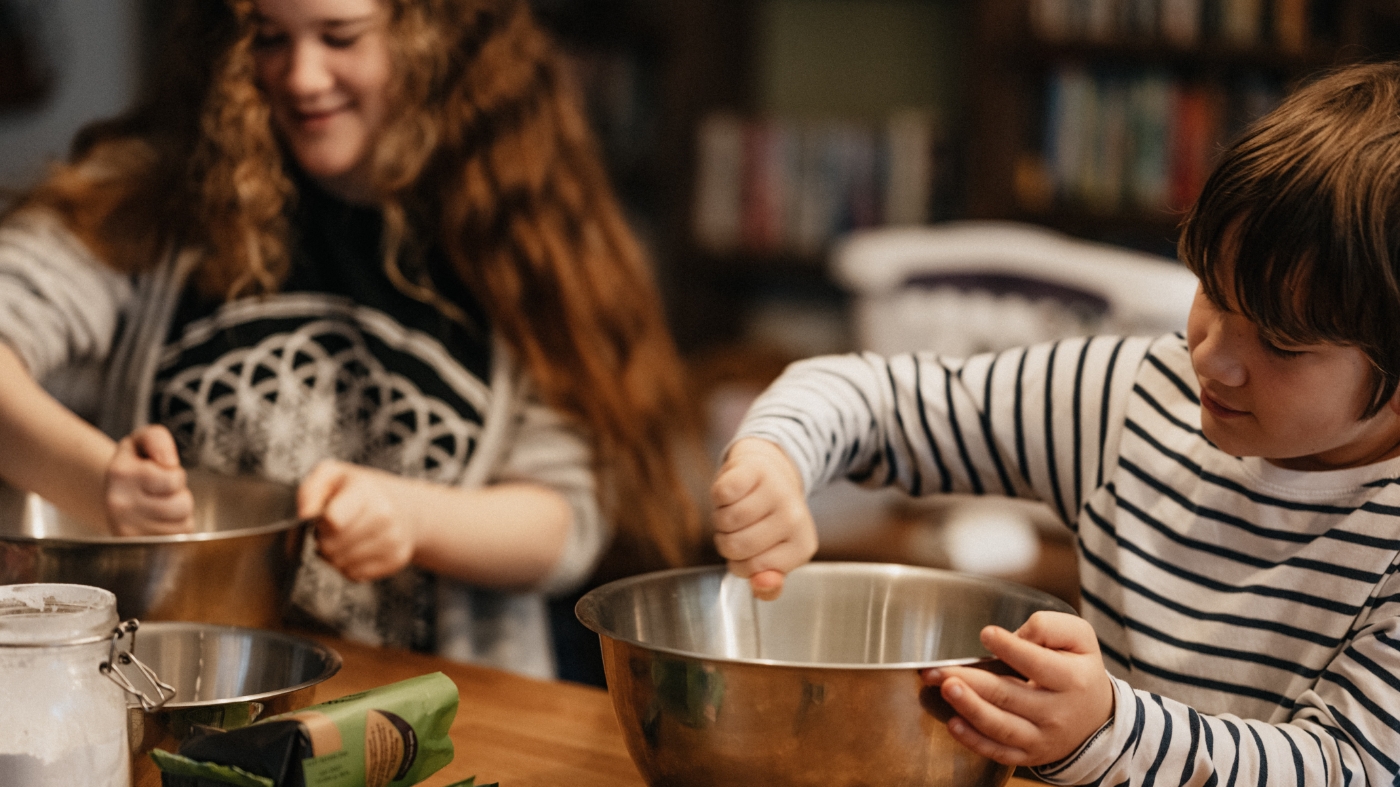 Kids helping out the community by helping cook food for others