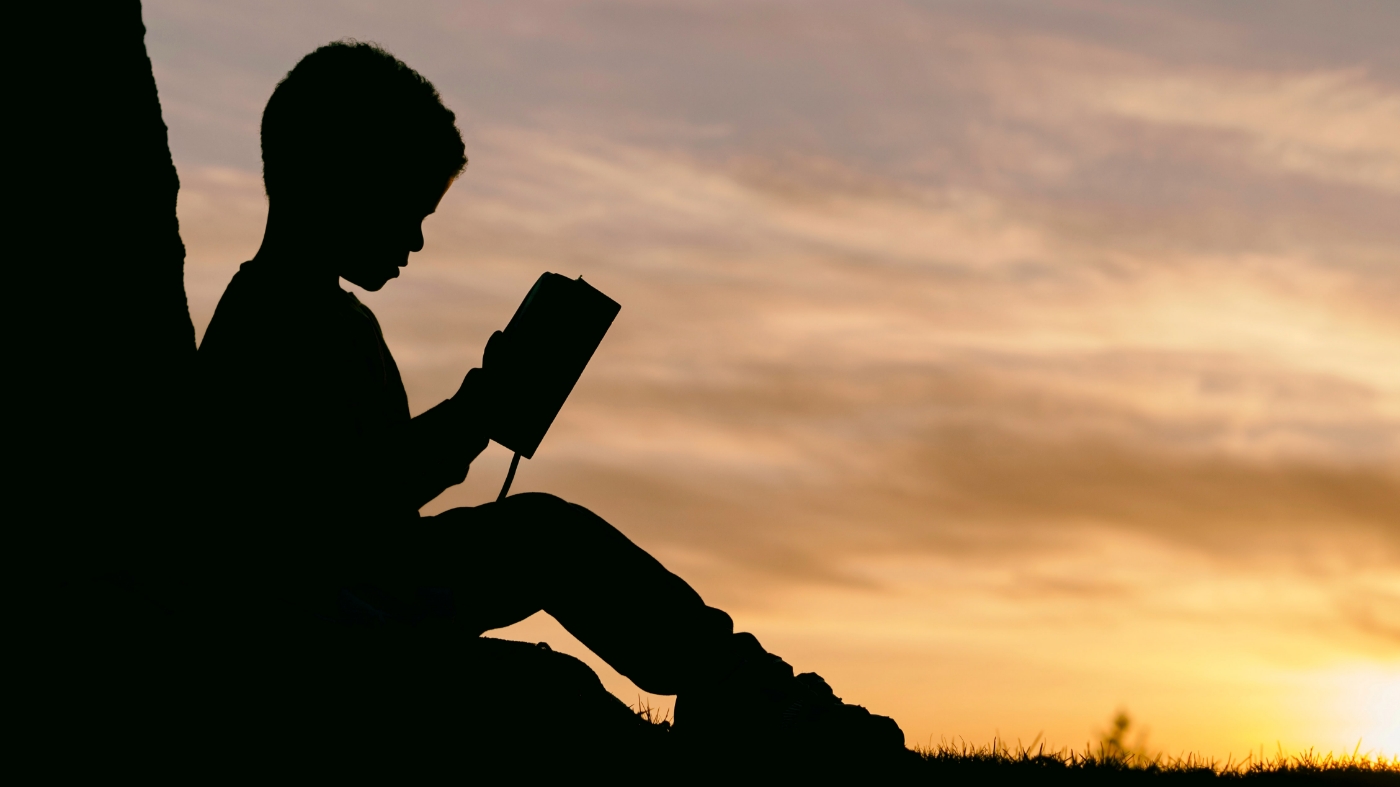 Kid reading the bible