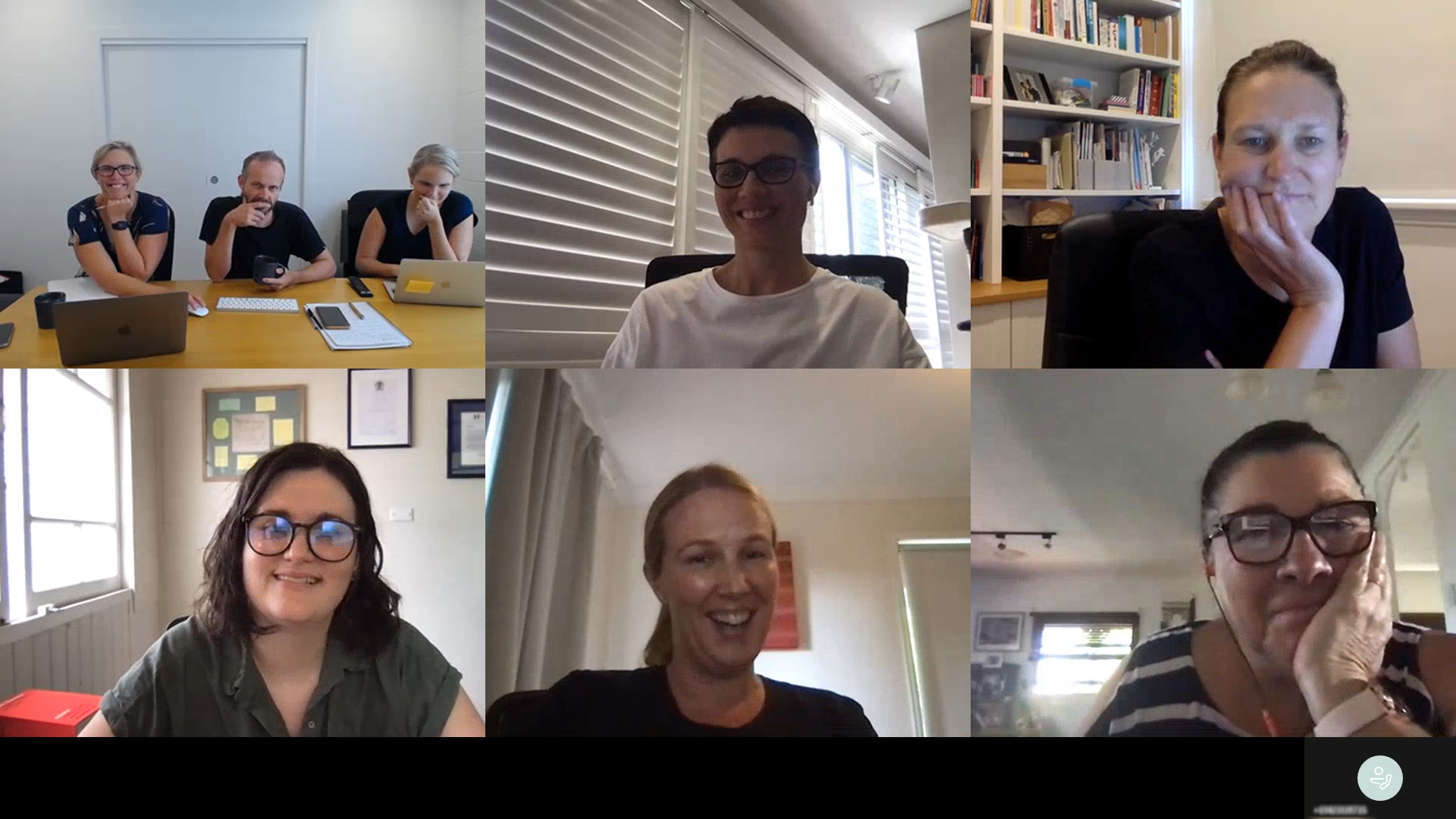 Screenshot of a Microsoft teams video call separated into six participants. In the top left there three people wearing black at a conference table, in the top middle there is a woman in glasses and a white shirt in front of window blinds, in the top right there is a woman in a black shirt with bookshelves behind her, in the bottom left is Alix with a window and framed pictures behind her, in the bottom middle is a blond woman in a black shirt speaking, and in the bottom right is a woman in a black and white striped shirt with glasses.