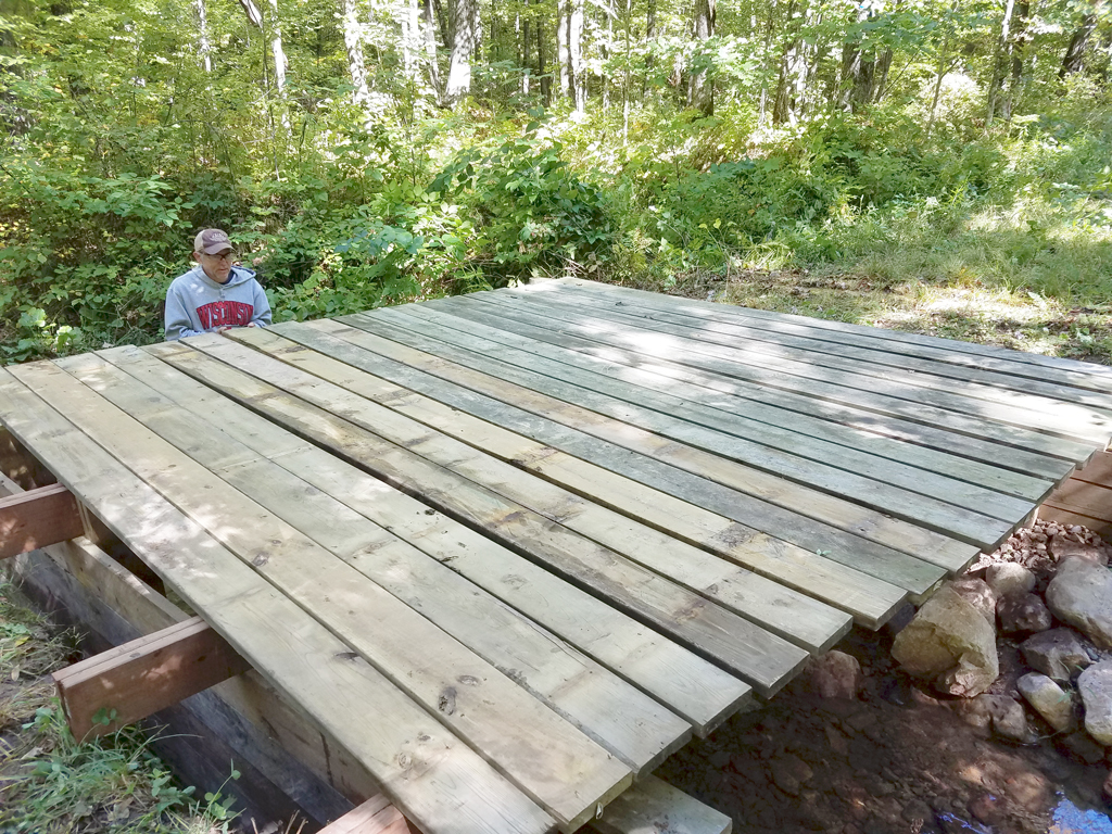 applying the decking on the repaired bridge