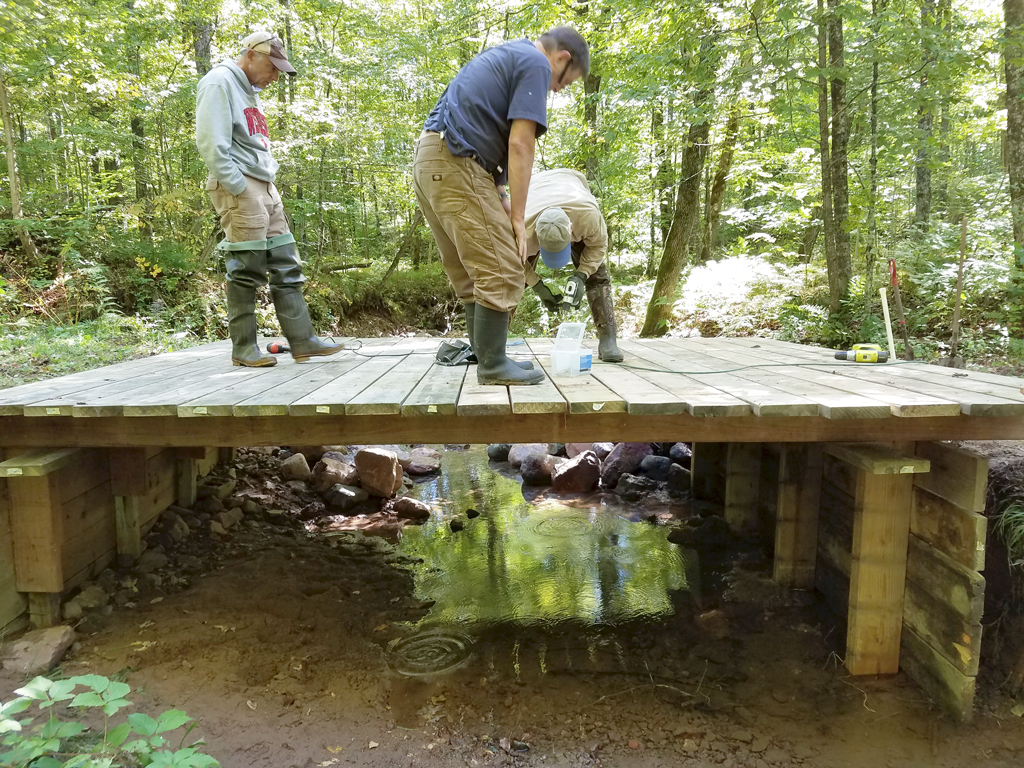 applying the decking on the repaired bridge