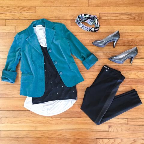 Flat lay: teal, velvet blazer with a black, studded, flowy tank, and black, sleek skinny jeans, metallic heels, and Regenerous Designs headband.