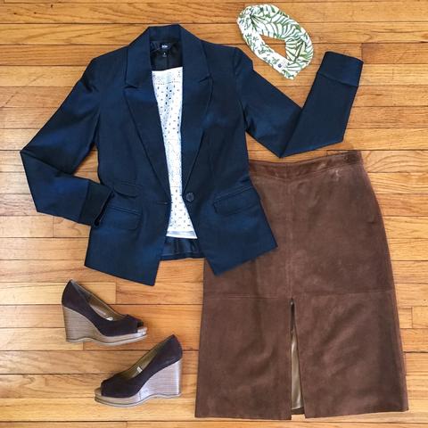 Flat lay: navy blazer, ivory crop top, light brown, suede skirt, dark brown wedges, and green and ivory Regenerous Designs headband.