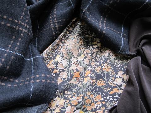 Neutral floral print fabric, black-brown-ivory wool plaid, grey and brown knit jersey fabric.