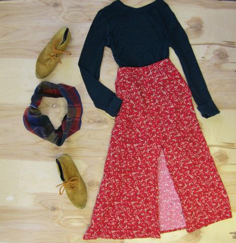 Flat lay: Red flower skirt pared with black long sleeve top, mustard colored shoes, and Regenerous Designs colorful plaid infinity scarf.