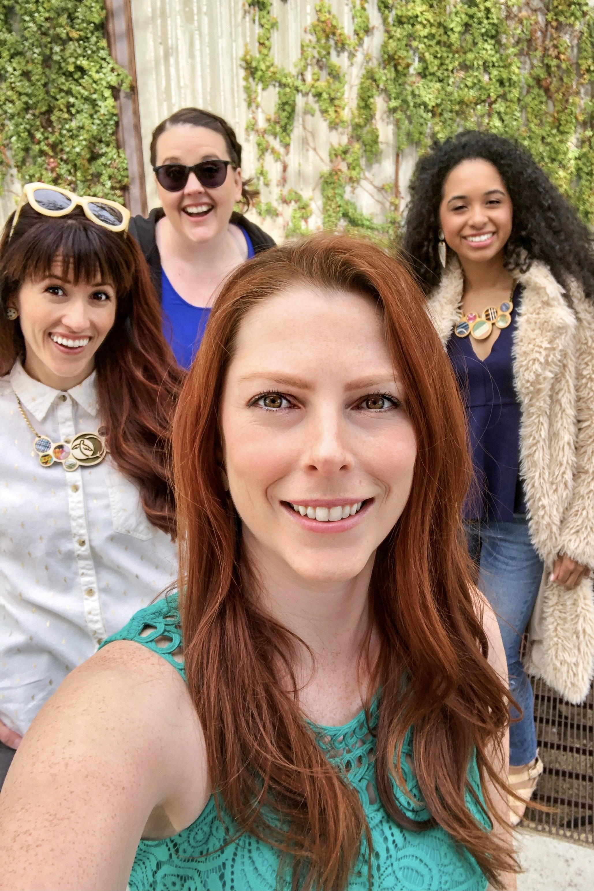 4 girls wearing Regenerous Designs accessories smiling at the camera or a selfie